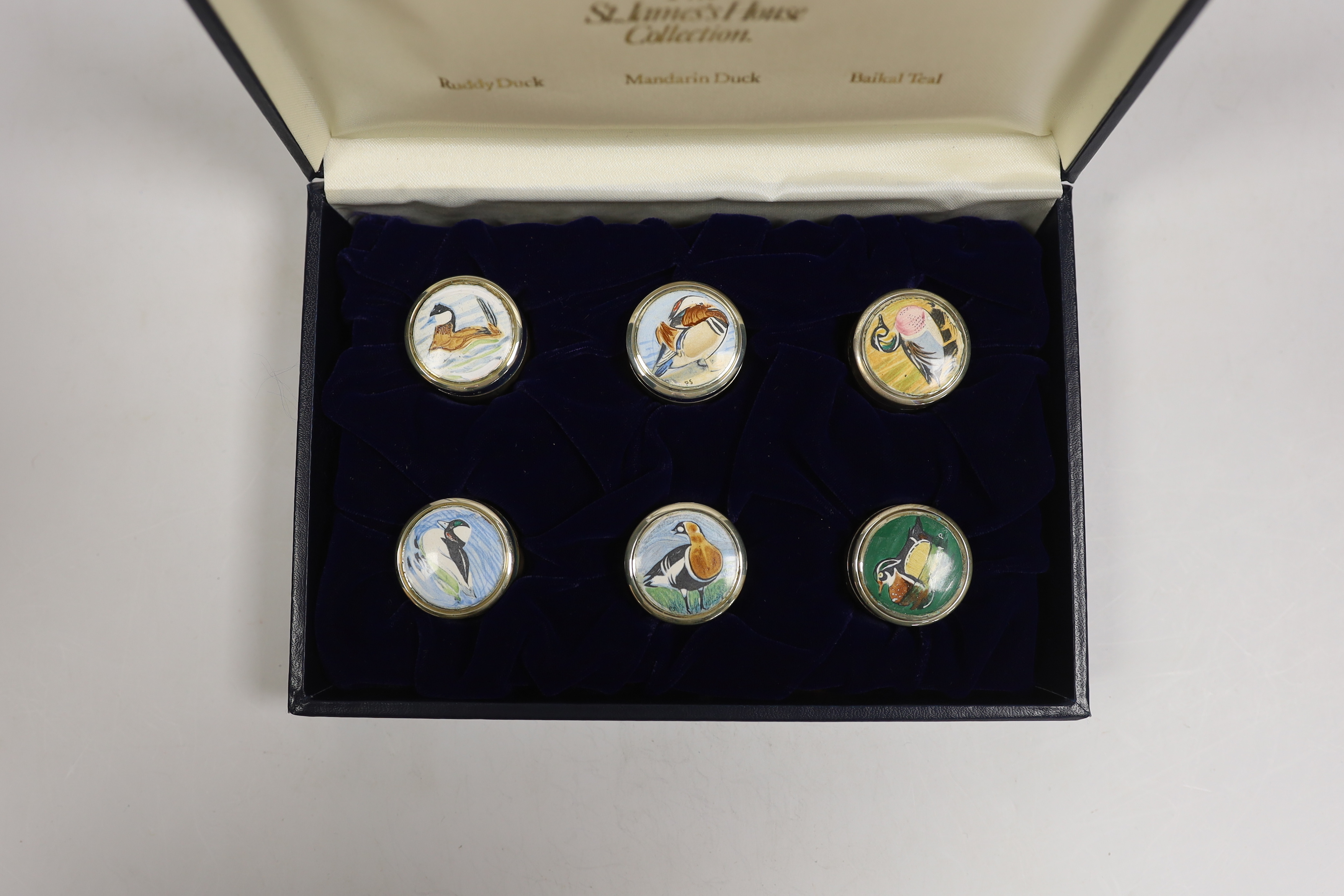 A cased set of six Elizabeth II St James's House Collection silver and enamel wild bird pill boxes, diameter 32mm, with certificate.